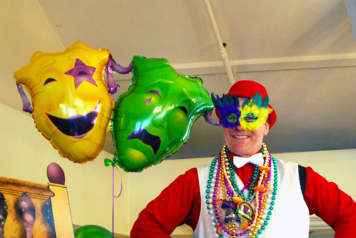Clown at Mardi Gras themed membership event